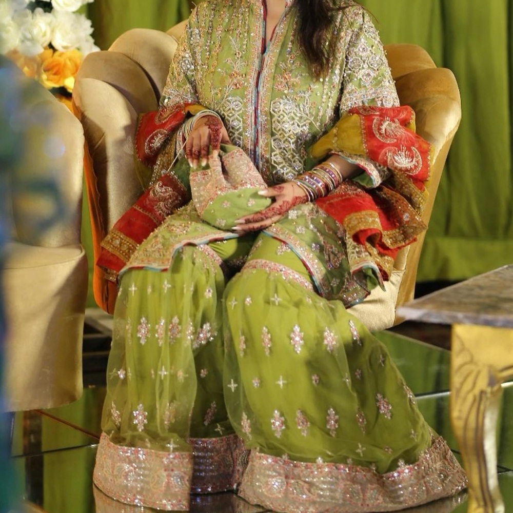 A Qalamkar pakistani Shararra with a top and potli